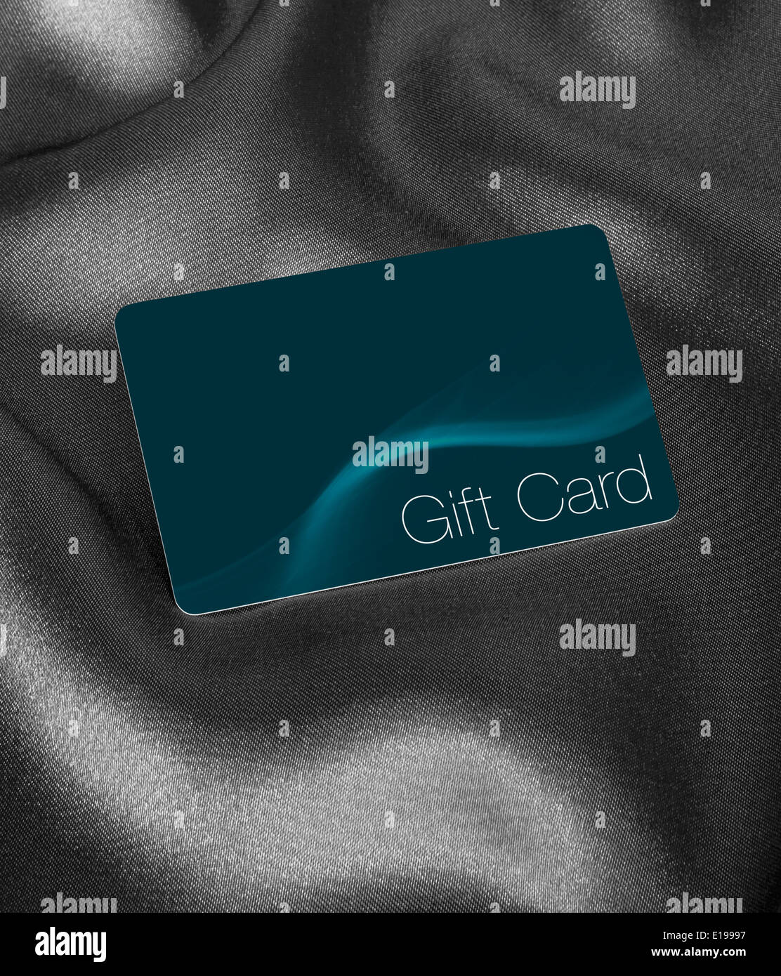 Store Gift Card now used instead of gift vouchers against a silk background with blank area for inserting your own brand or logo Stock Photo