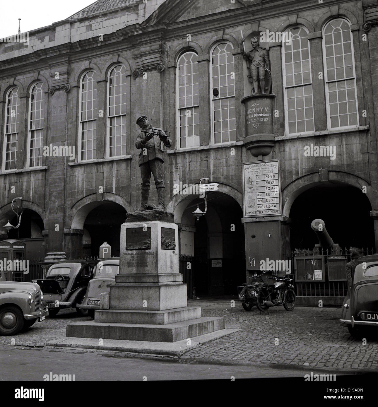 1950s historical view of memorial statue to Aviation pioneer Charles Rolls in front of Shire Hall, Agincourt Sq, Monmouth, Wales Stock Photo