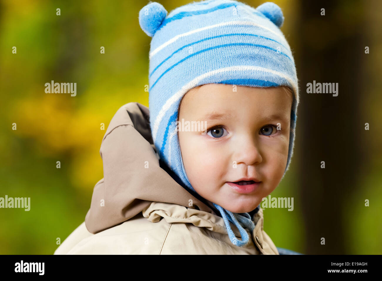 Portrait of little baby boy in the park Stock Photo