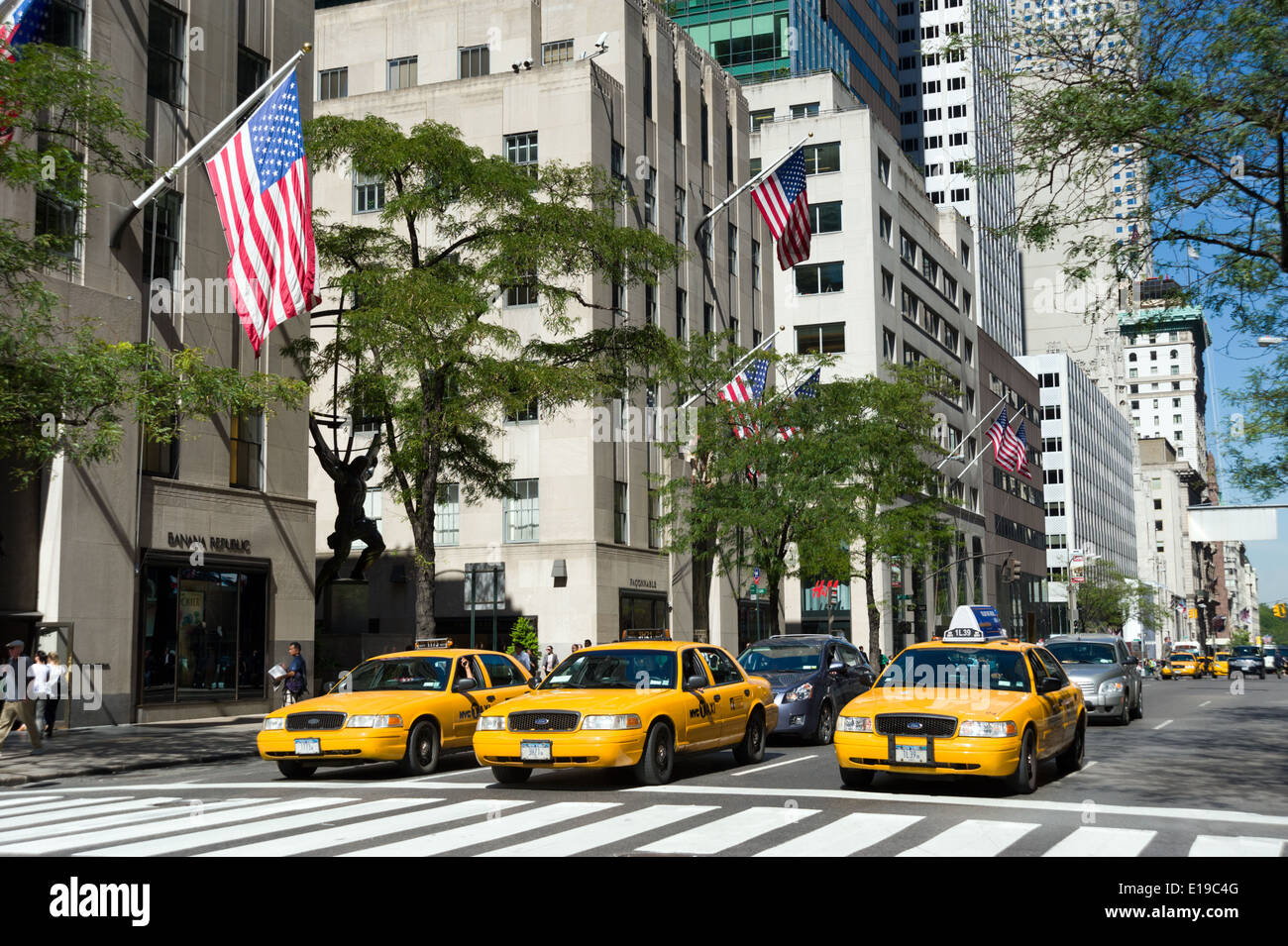 Yellow taxis on Fifth Avenue, New York City streets, USA Stock Photo