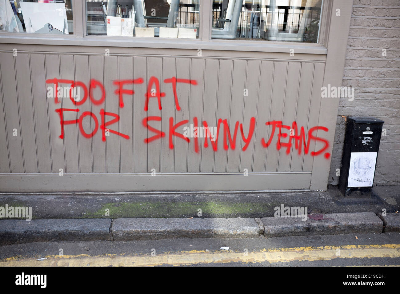 Too Fat For Skinny Jeans Graffiti Shoreditch London Stock Photo