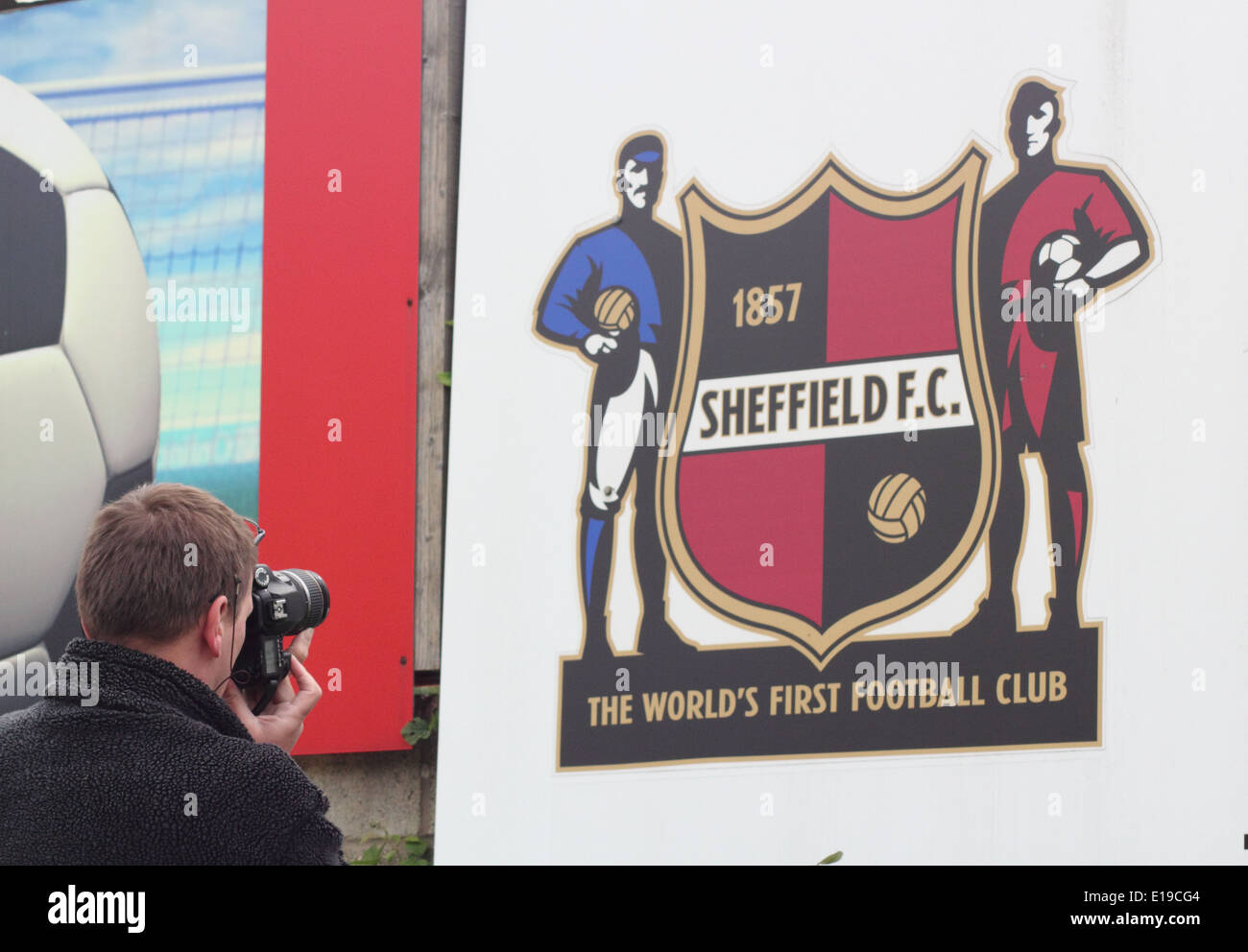 A man photographs the logo of  Sheffield Football Club; the world's first football club at it's ground, England UK. Stock Photo