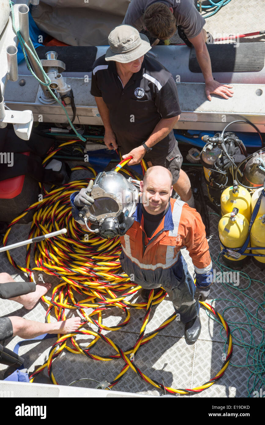 Commercial diver diving in Napier Port North Island New Zealand Stock