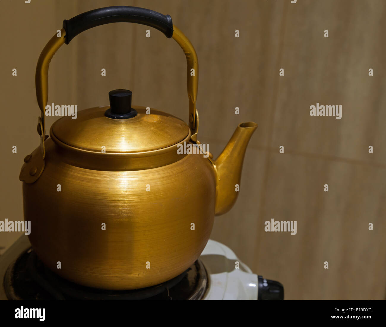 Vintage large aluminum tea pot kettle stove top isolated Stock Photo by  puhimec