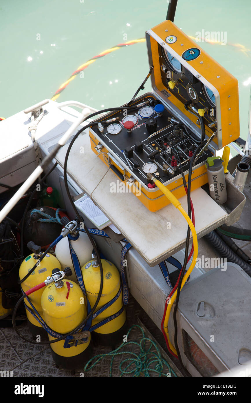 Air supply and control equipment for a commercial diver Air line is coloured yellow and red Stock Photo