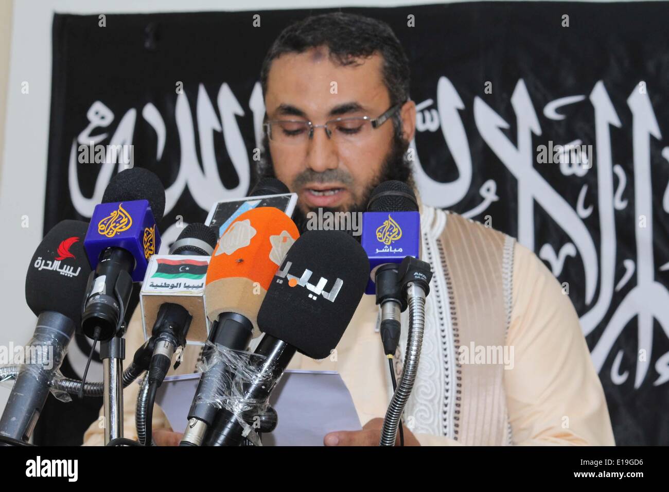 (20140527)--BENGHAZI, May 27, 2014(Xinhua) -- Leader of the Ansar al-Sharia Benghazi Brigade Mohammed Al-Zahawi addresses a press conference in Benghazi, Libya on May 27, 0214. The jihadist group made a statement on Tuesday that it will defend its strongholds in Benghazi against the expansion of opposing forces. Ansar al-Sharia is listed as a foreign terrorist organization by the United States and it was allegedly the designer of the 2012 attack on the U.S. consulate in Benghazi in which U.S. Ambassador Chris Stevens was killed. (Xinhua/Mohammed Elzahawi) Stock Photo