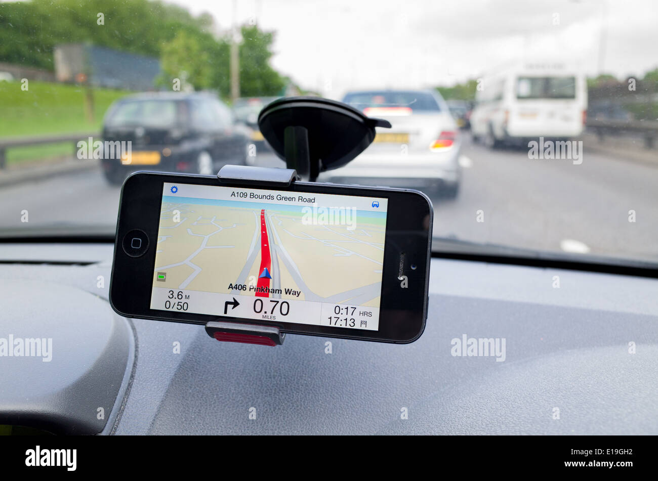 TomTom satnav iPhone app used on A406 North Circular Road, London, England, UK Stock Photo