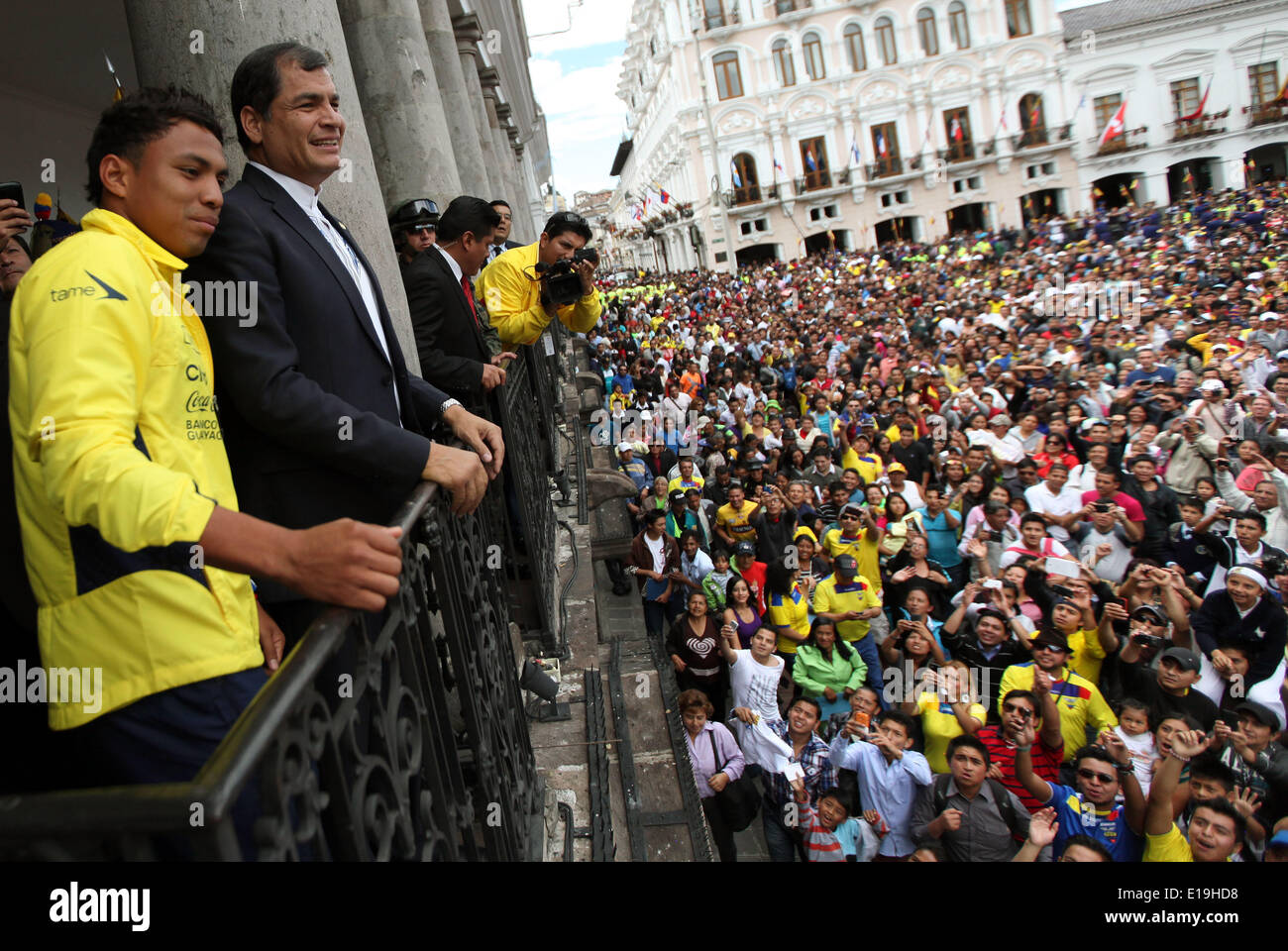 Quito. 28th May, 2014. Ecuator's President Rafael Correa (2nd L) and player Jefferson Montero (1st L) react during the farewell act for Ecuador's national soccer team, in the Grande Square, in Quito, capital of Ecuador. Ecuador's national soccer team got farewell by its supporters in an act where President Rafael Correa delivered to the capitan Luis Antonio Valencia the Tricolor Flag as sign of support to the team by the Ecuatorian people, according to local press. © Santiago Armas/Xinhua/Alamy Live News Stock Photo