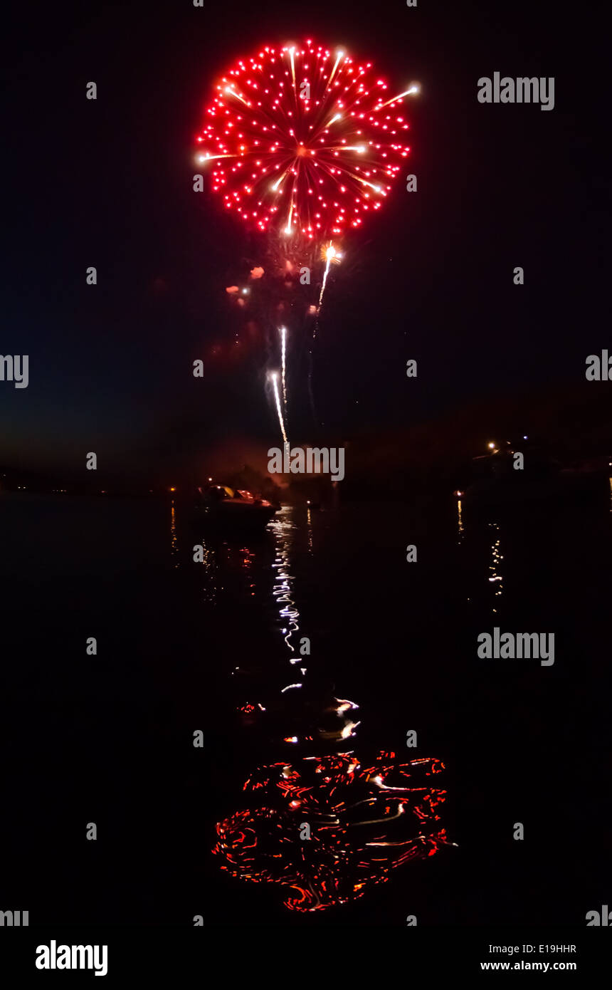 Red Fireworks and Reflection in River Stock Photo - Alamy