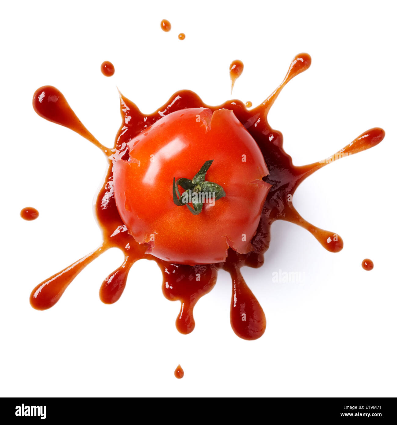 splattered tomato with ketchup isolated on white background Stock Photo