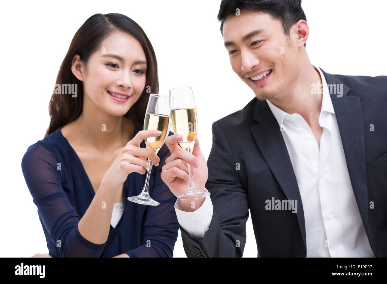 Happy young couple toasting champagne flutes Stock Photo