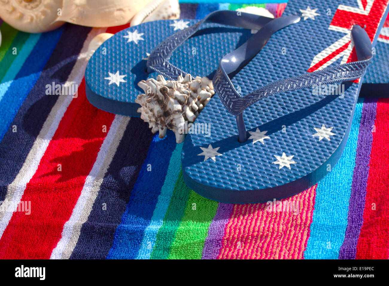 blue flip flops on beach towel Stock Photo - Alamy