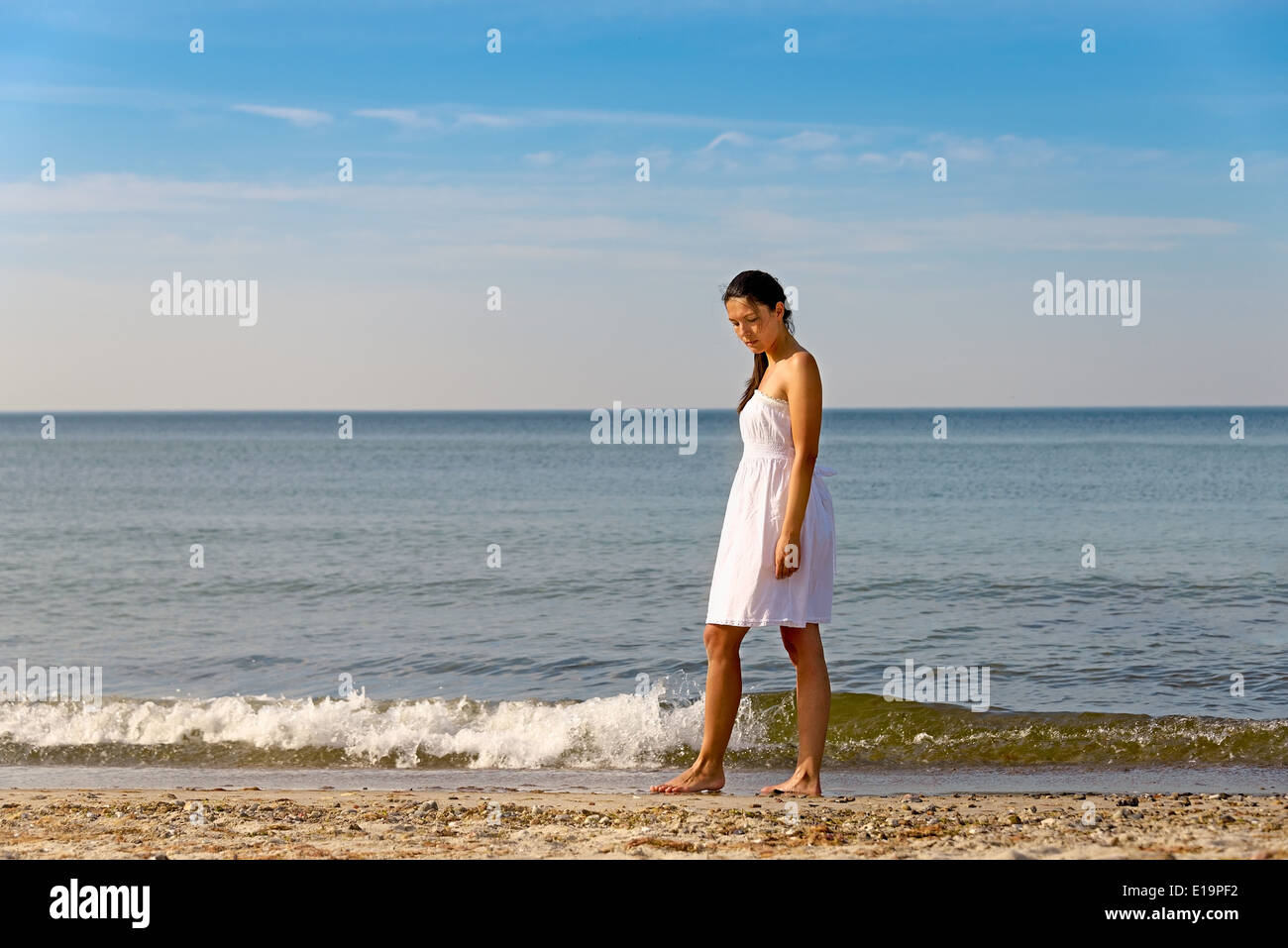 Meditative beautiful woman on a tropical beach Stock Photo