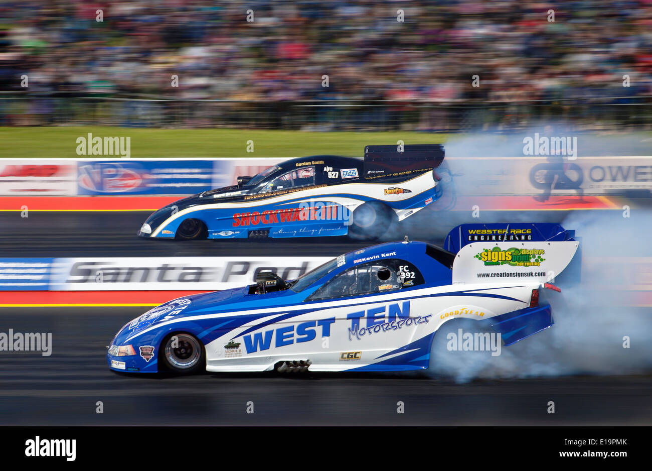 Top Fuel Funny car drag racing at Santa Pod. Kevin Kent Nearside, Gordon Smith far side. Stock Photo