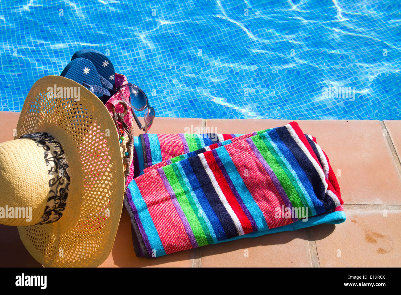 towel and bathing accessories near pool Stock Photo - Alamy