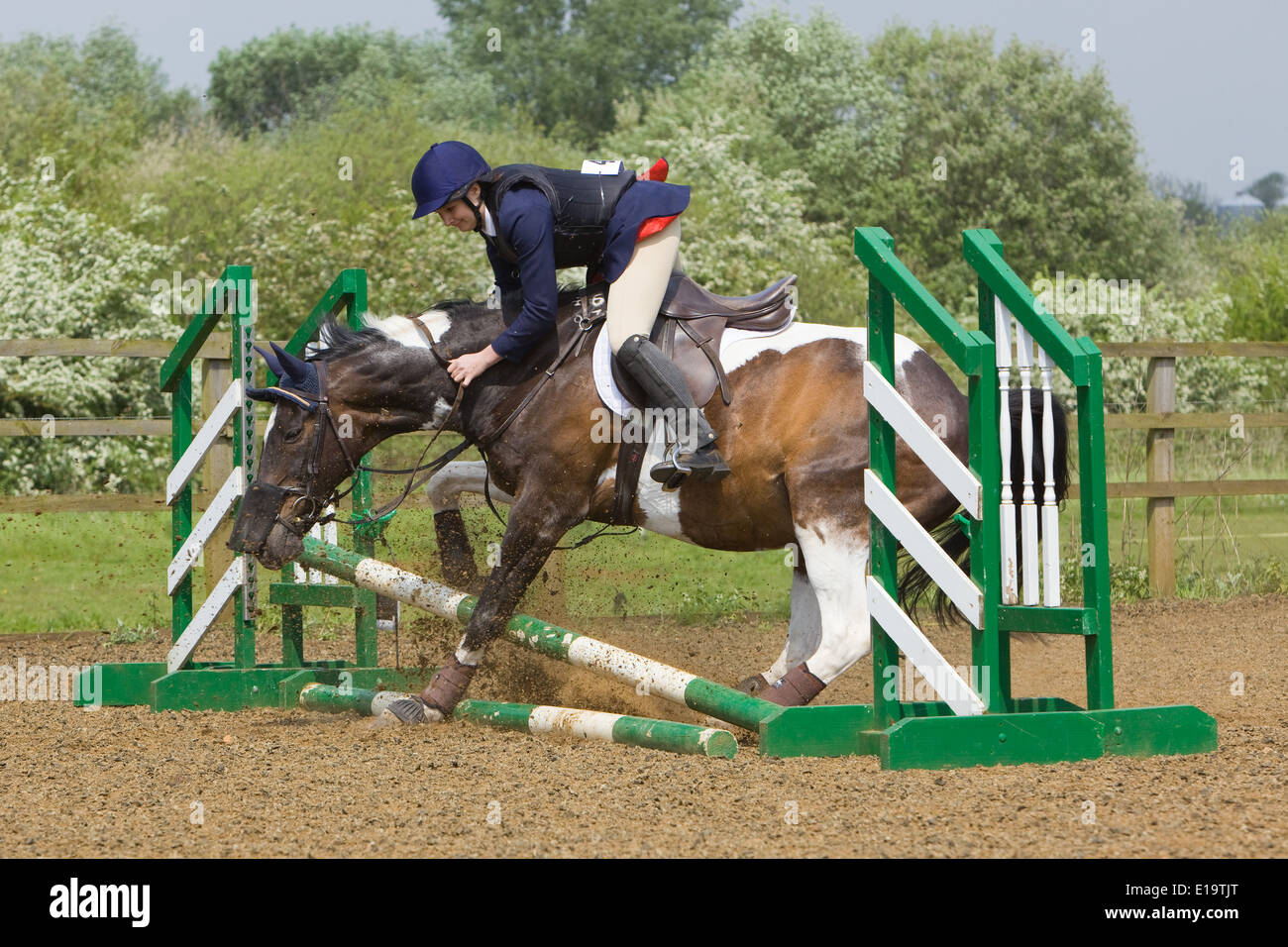 One of a series of photos showing a rider being thrown from her horse