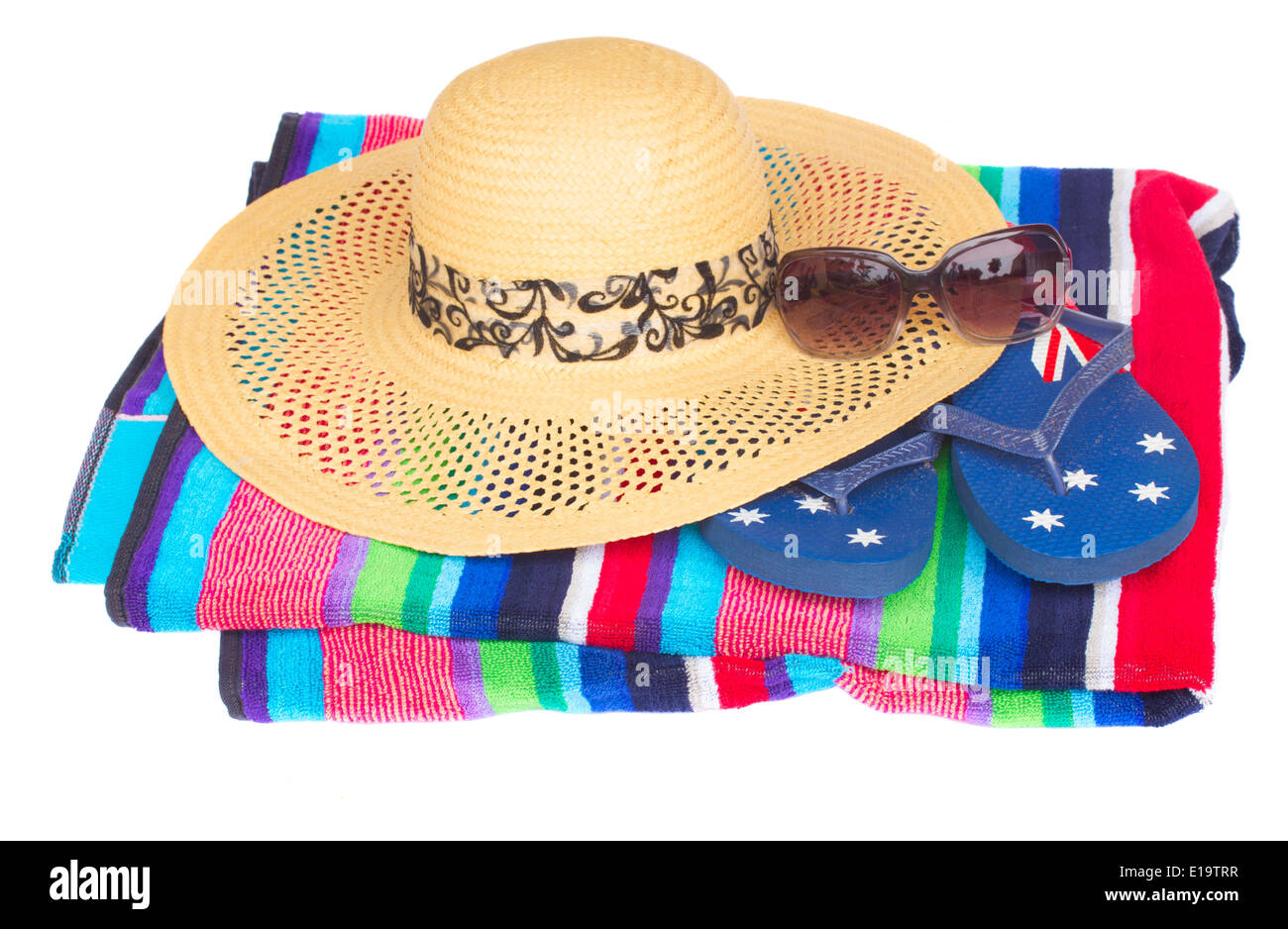 straw hat on beach towel Stock Photo Alamy