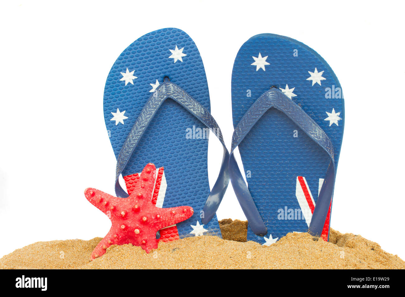 blue  sandals and starfish in sand Stock Photo