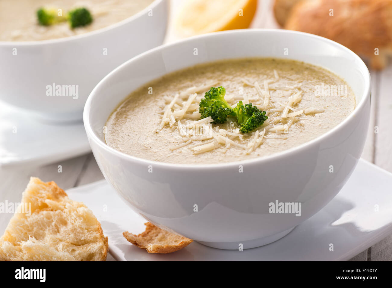 A delicious and healthy cream of brocolli and whole wheat couscous soup garnished with parmesan cheese. Stock Photo