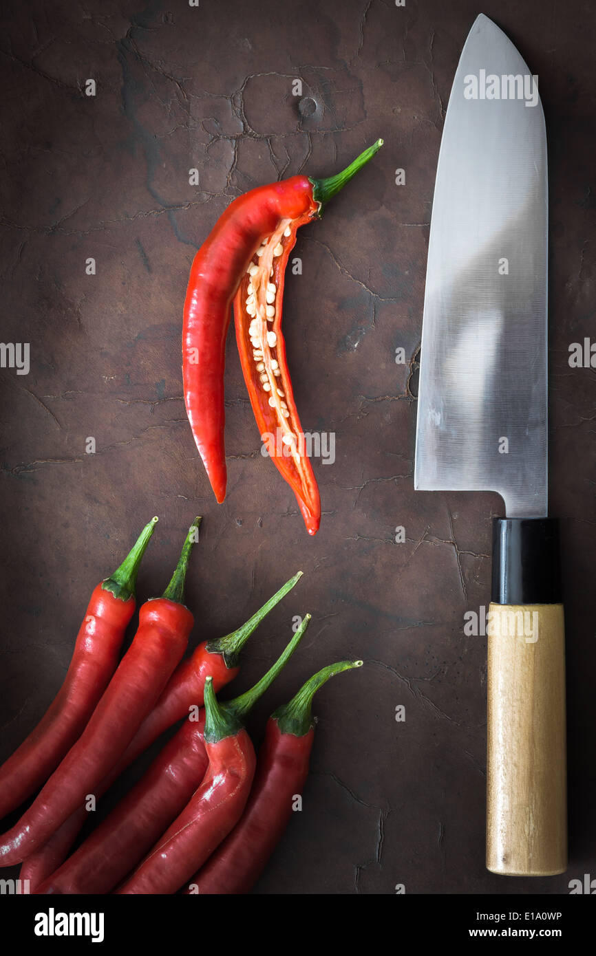 japanese Knife with Chili on old Leather Stock Photo Alamy