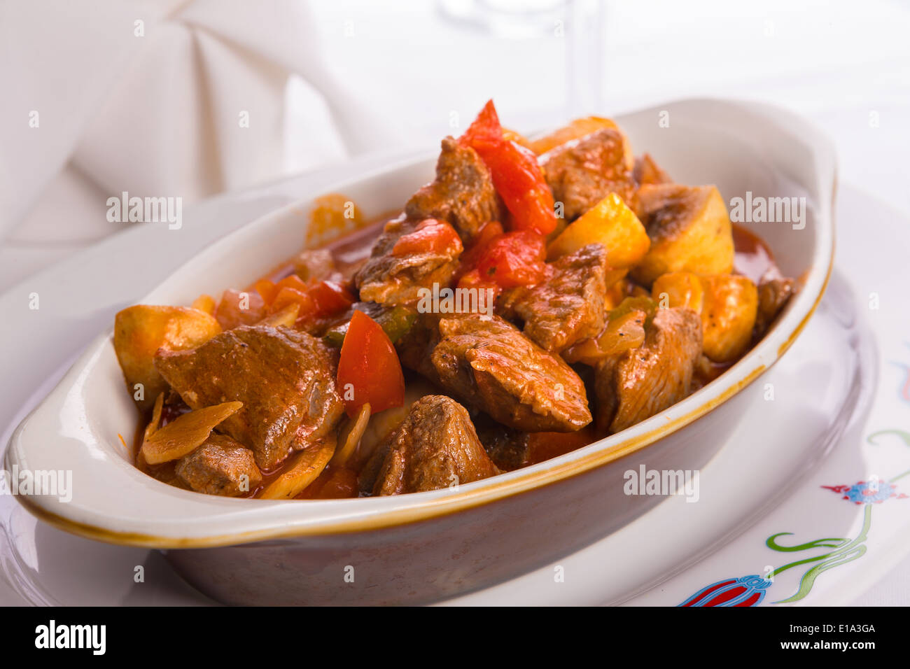 Beef Saute with Tomatoes, mushrooms and onions served in Oval Baking Dish Stock Photo