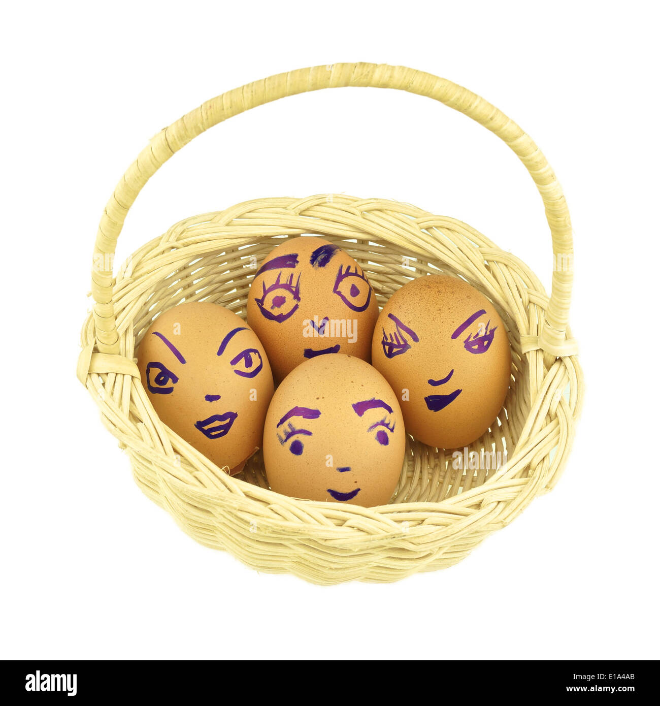 Happy and fun emoticons on empty eggshell in basket isolated with white background. Stock Photo