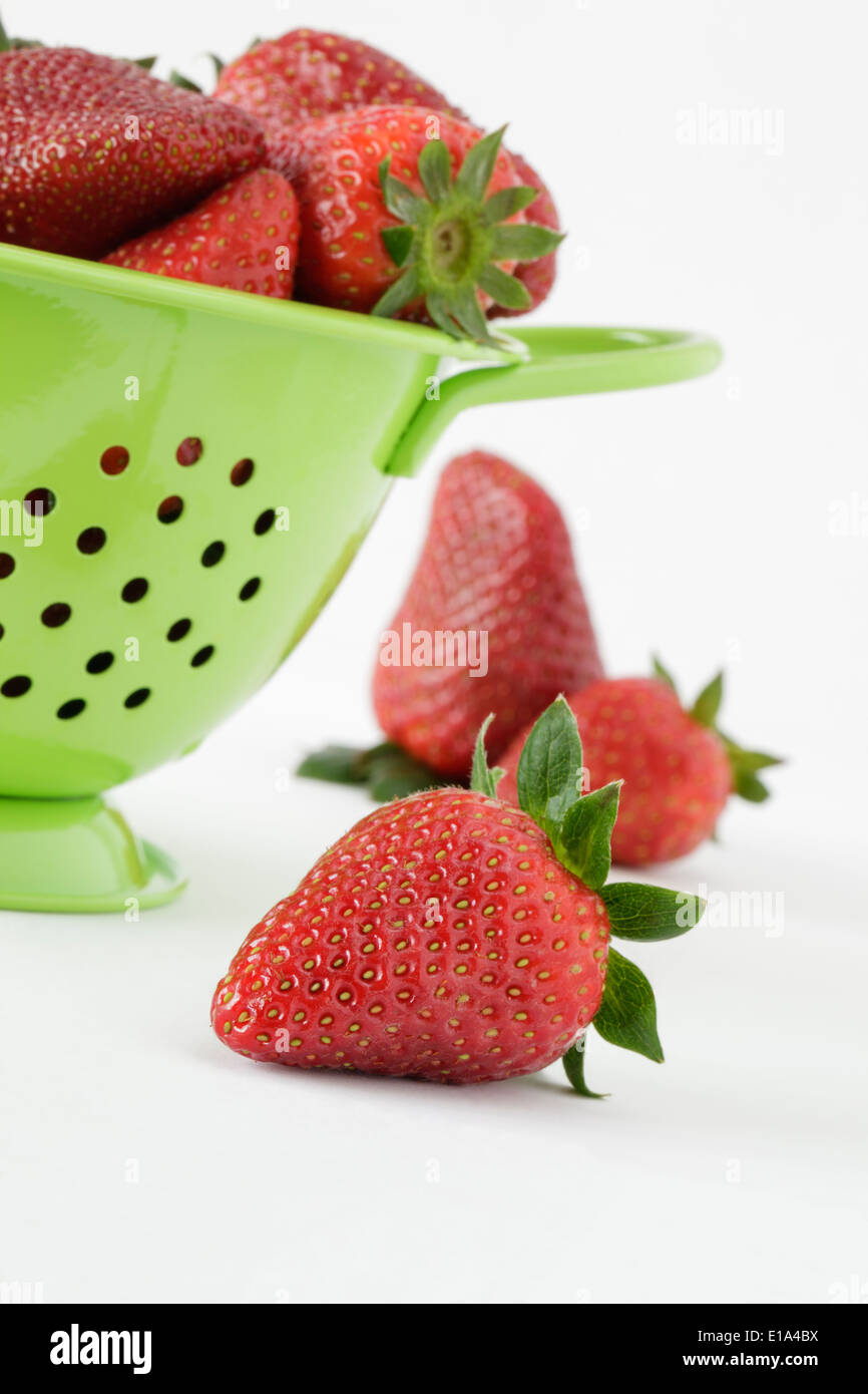 Fresh Strawberries and green colander Stock Photo