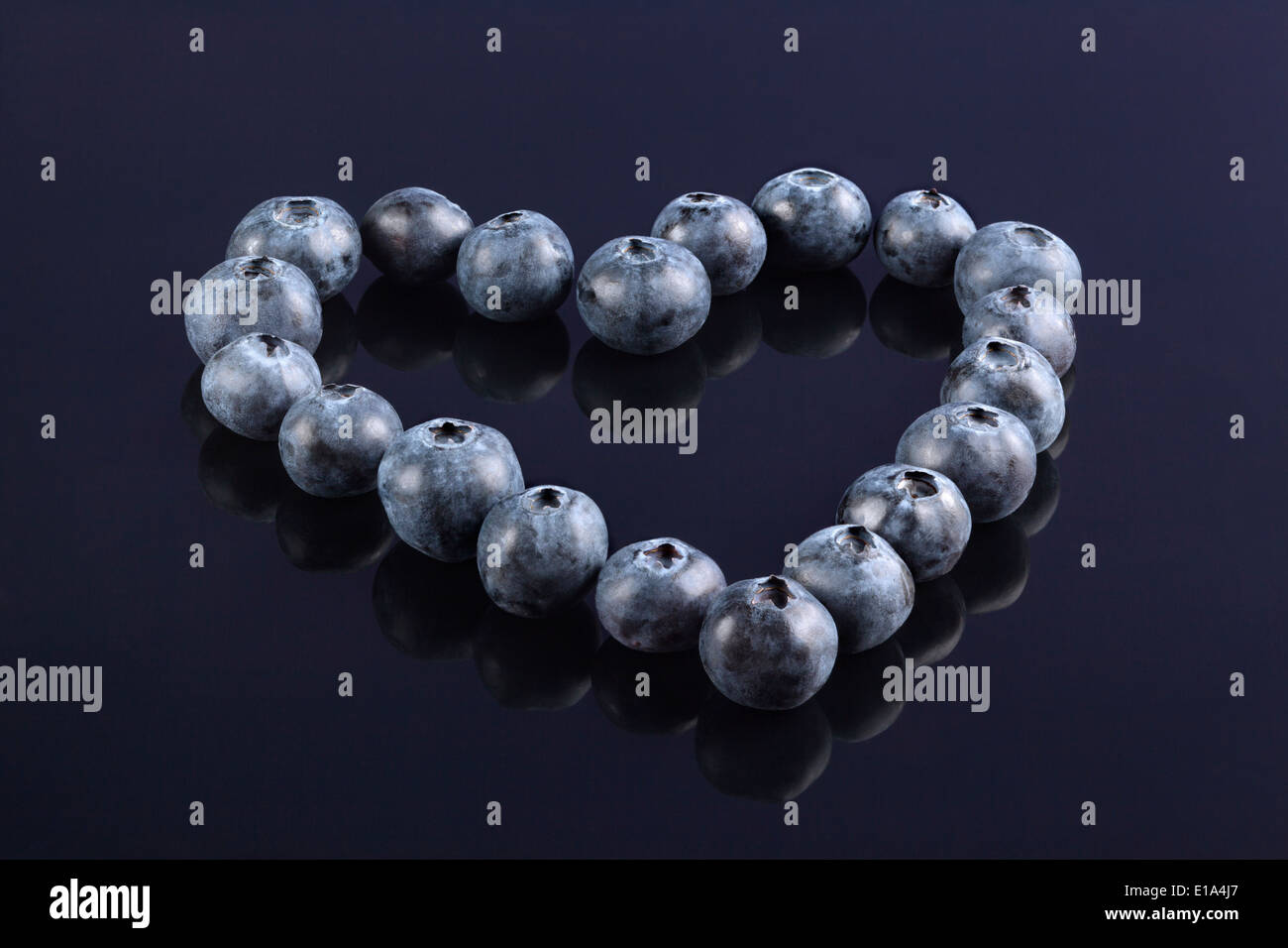 Fresh Blueberries arranged in the shape of a Heart Stock Photo