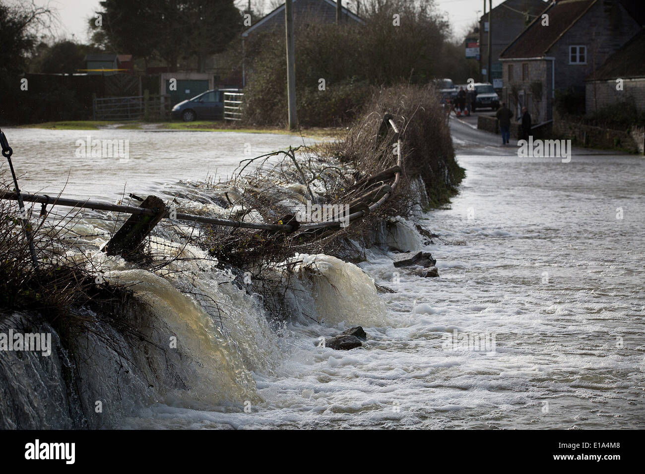 Flood water smashes through a wall in Langport, Somerset, Stock Photo