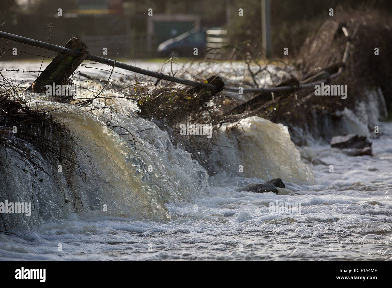 Flood water smashes through a wall in Langport, Somerset, Stock Photo