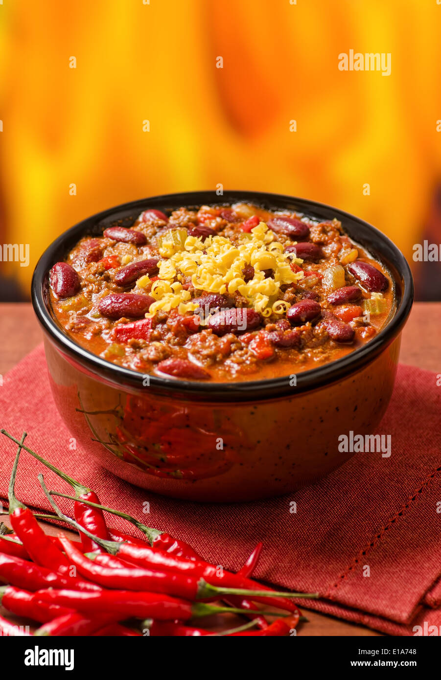 A hearty bowl of chili con carne with hot peppers. Stock Photo
