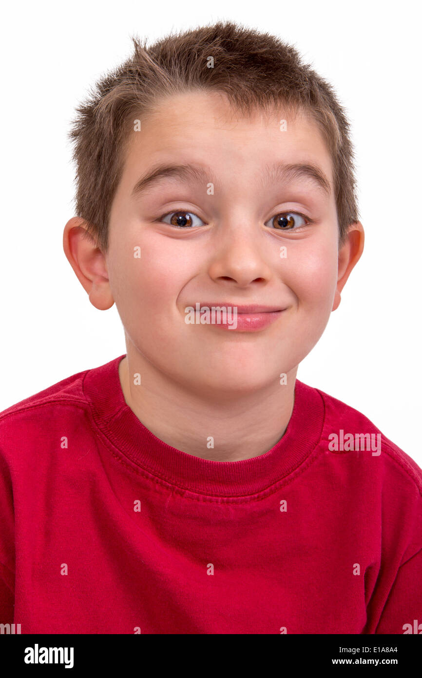 Mischievous kid looking at you and giving persnickety look Stock Photo