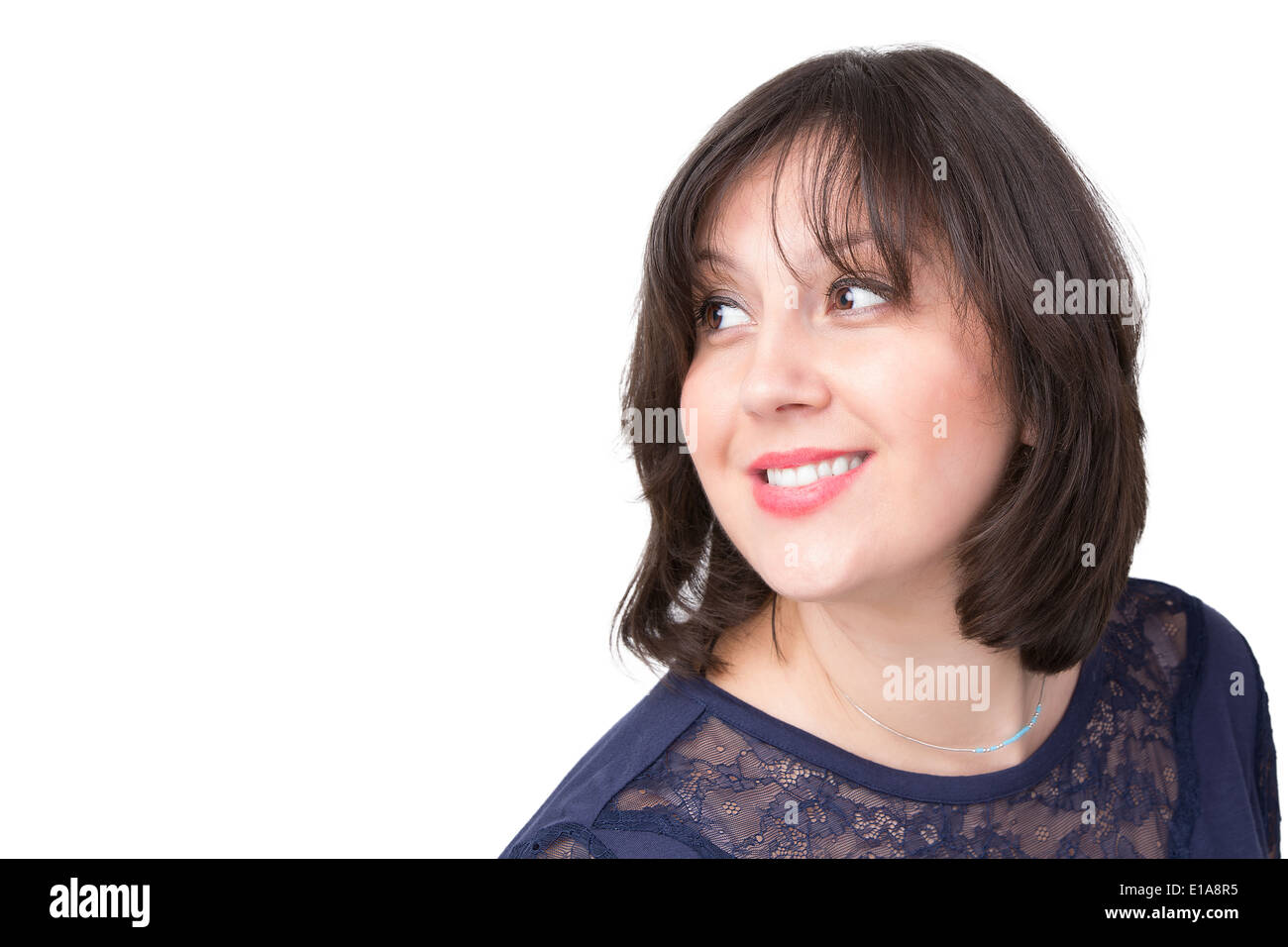 Portrait of Dark Hair Turkish businesswoman looking out happily and charmed Stock Photo