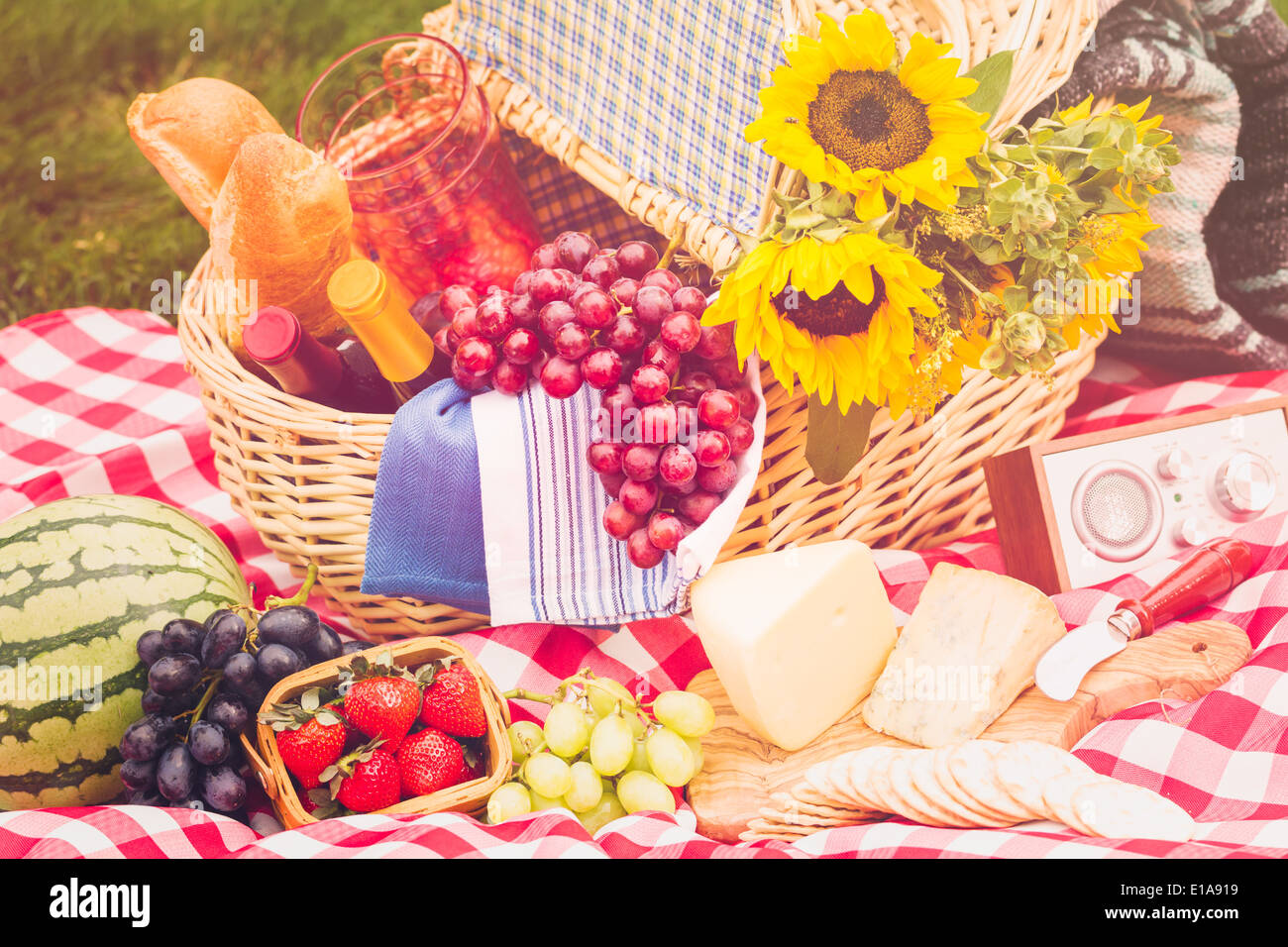 Summer picnic with a basket of food in the park Stock Photo - Alamy