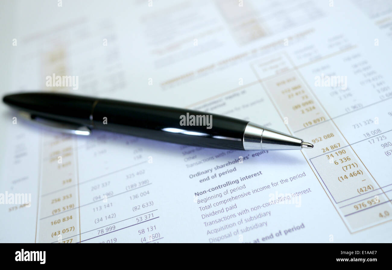 financial results document and pen Stock Photo
