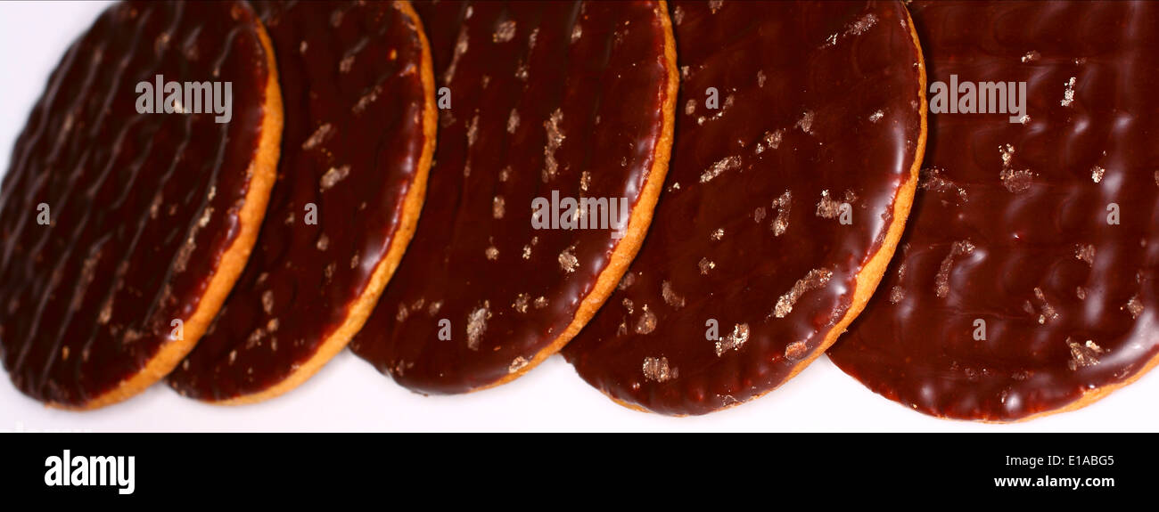 Plain Chocolate digestives on white background Stock Photo