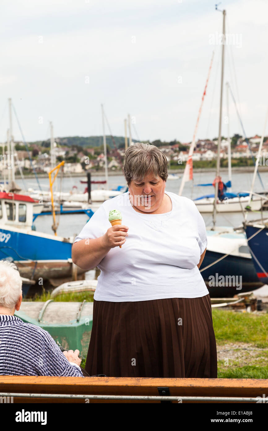 Woman eating ice cream fat hires stock photography and images Alamy