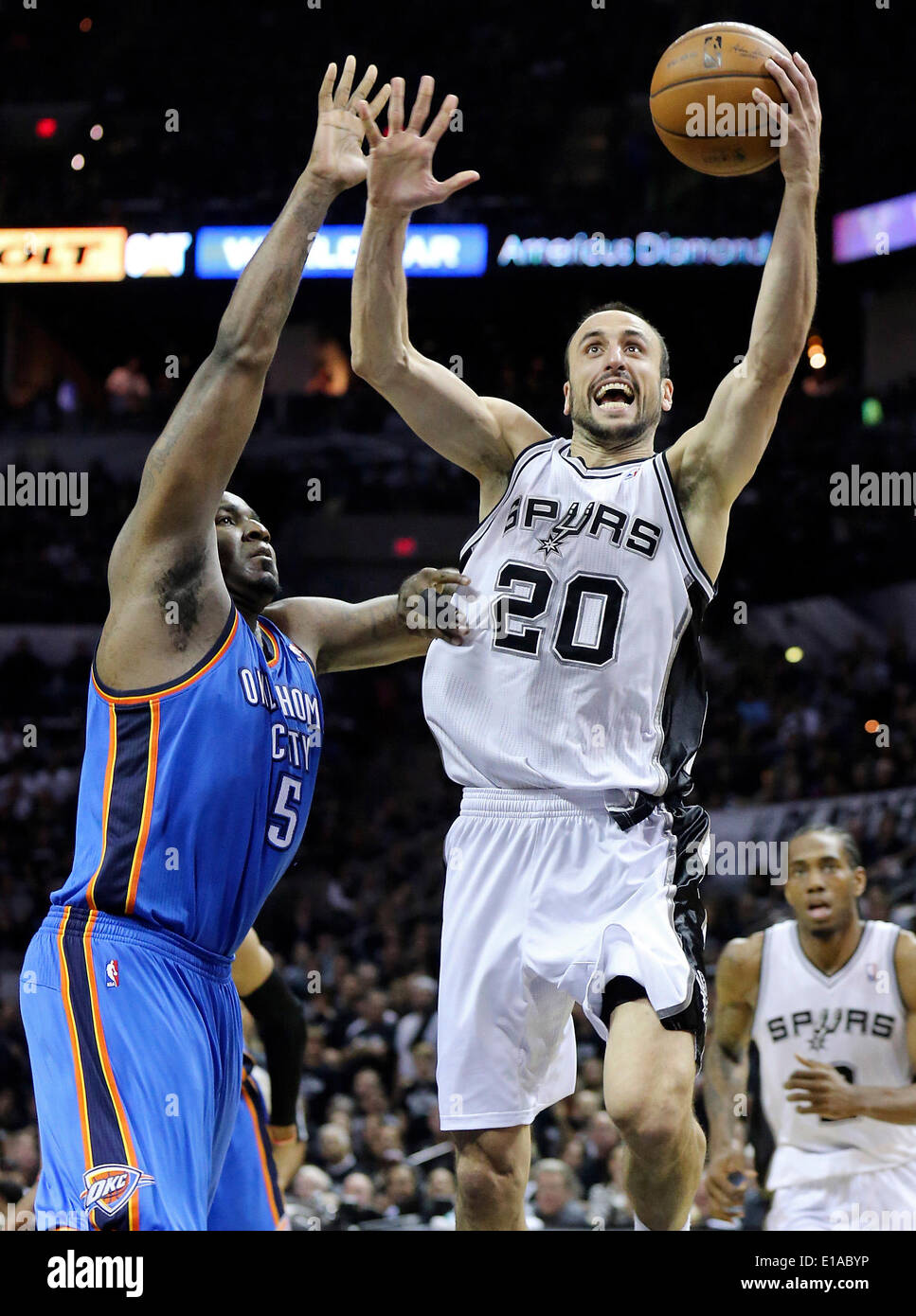 May 19, 2014 - San Antonio, TEXAS, USA - San Antonio Spurs' Manu Ginobili drives to the basket around Oklahoma City Thunder's Kendrick Perkins during second half action of Game 1 in the Western Conference Finals Monday May 19, 2014 at the AT&T Center. The Spurs won 122-105. (Credit Image: © San Antonio Express-News/ZUMAPRESS.com) Stock Photo