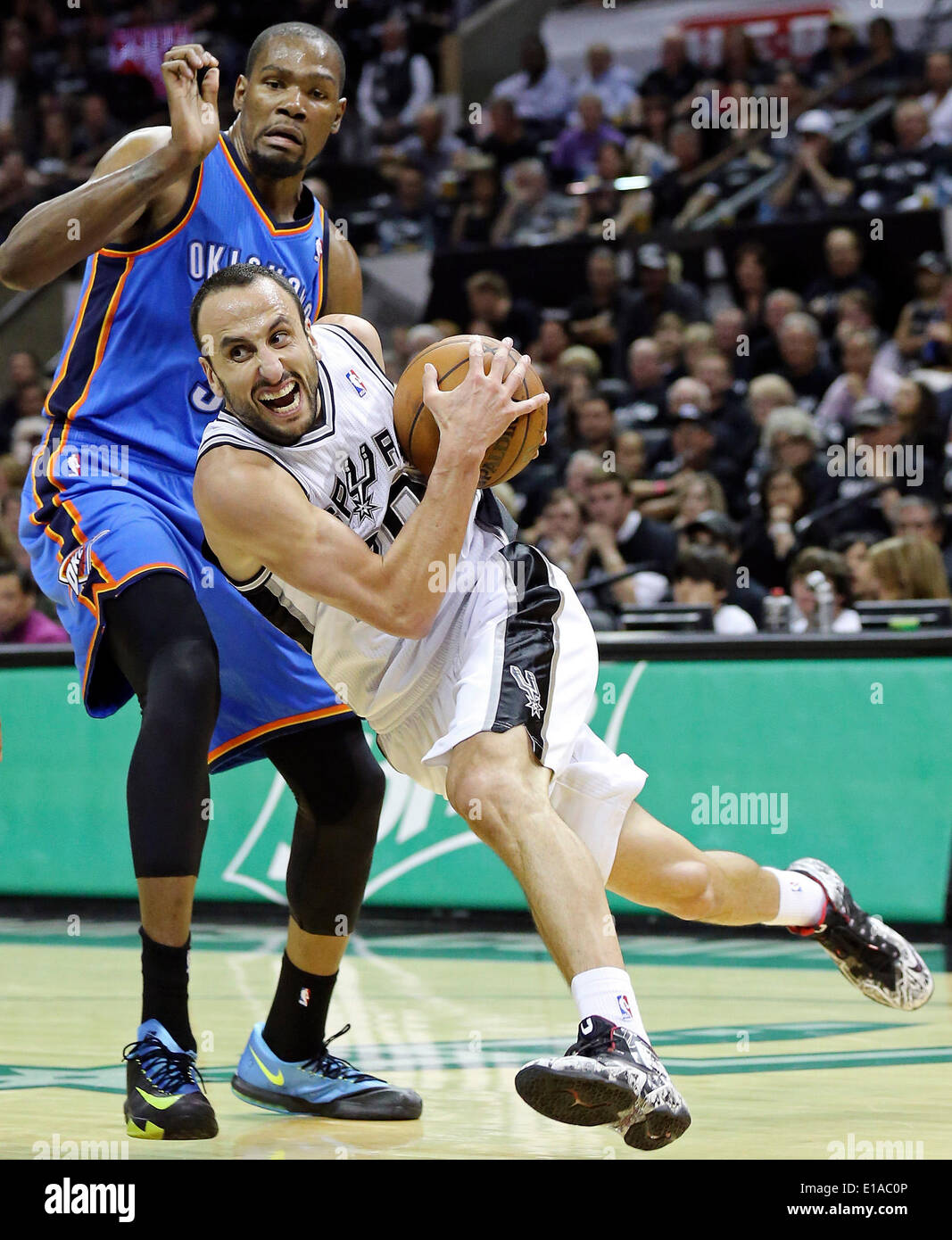 May 19, 2014 - San Antonio, TEXAS, USA - San Antonio Spurs' Manu Ginobili drives around Oklahoma City Thunder's Kevin Durant during second half action of Game 1 in the Western Conference Finals Monday May 19, 2014 at the AT&T Center. The Spurs won 122-105. (Credit Image: © San Antonio Express-News/ZUMAPRESS.com) Stock Photo