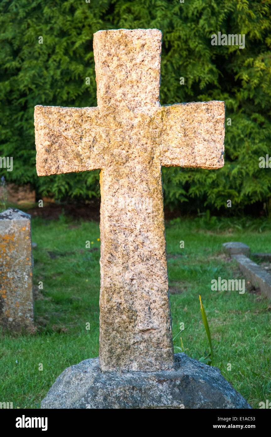 Granite cross in the churchyard of Holy Trinity Church, attended by