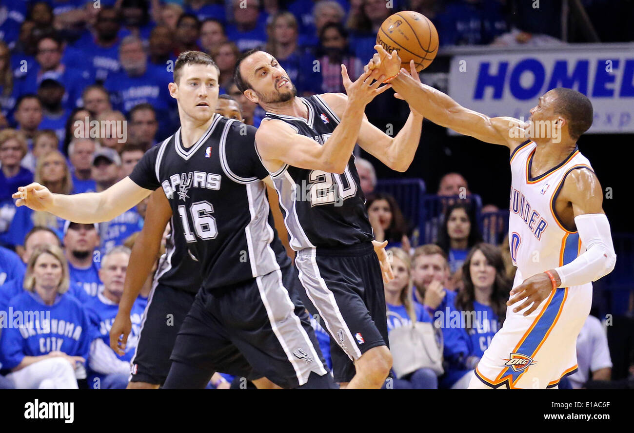May 25, 2014 - Oklahoma City, OKLAHOMA, USA - San Antonio Spurs' Manu Ginobili and Oklahoma City Thunder's Russell Westbrook grab for a loose ball as San Antonio Spurs' Aron Baynes (left) looks on during first half action in Game 3 of the Western Conference Finals Sunday May 25, 2014 at Chesapeake Energy Arena in Oklahoma City, OK. (Credit Image: © San Antonio Express-News/ZUMAPRESS.com) Stock Photo