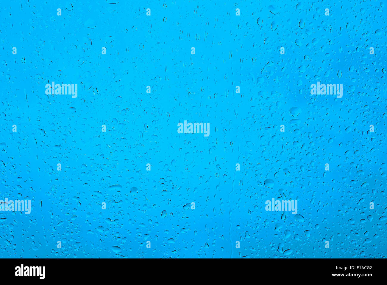 Water drops on the blue clean glass background Stock Photo - Alamy