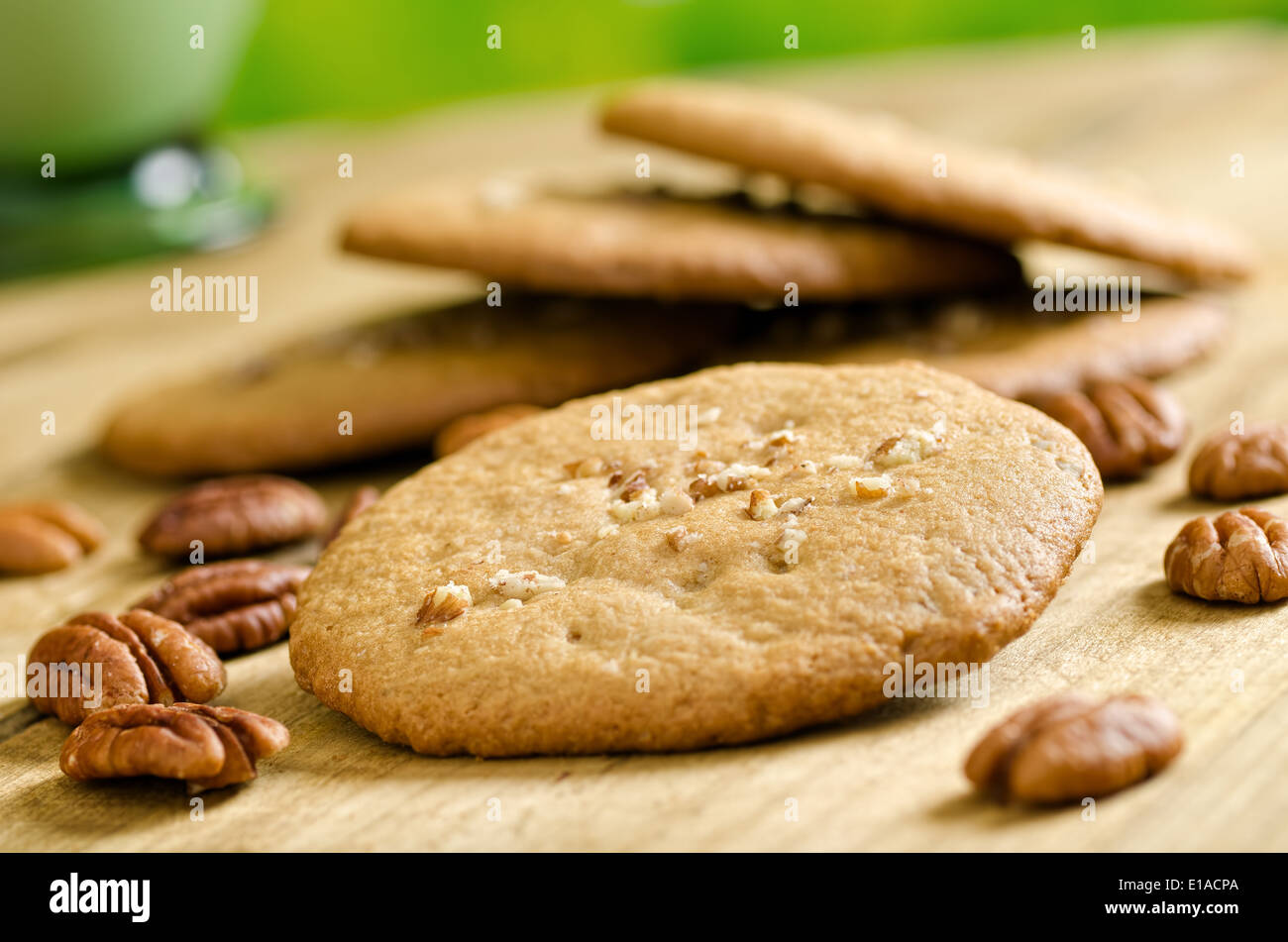 A stack of freshly baked pecan cookies with whole pecans. Stock Photo