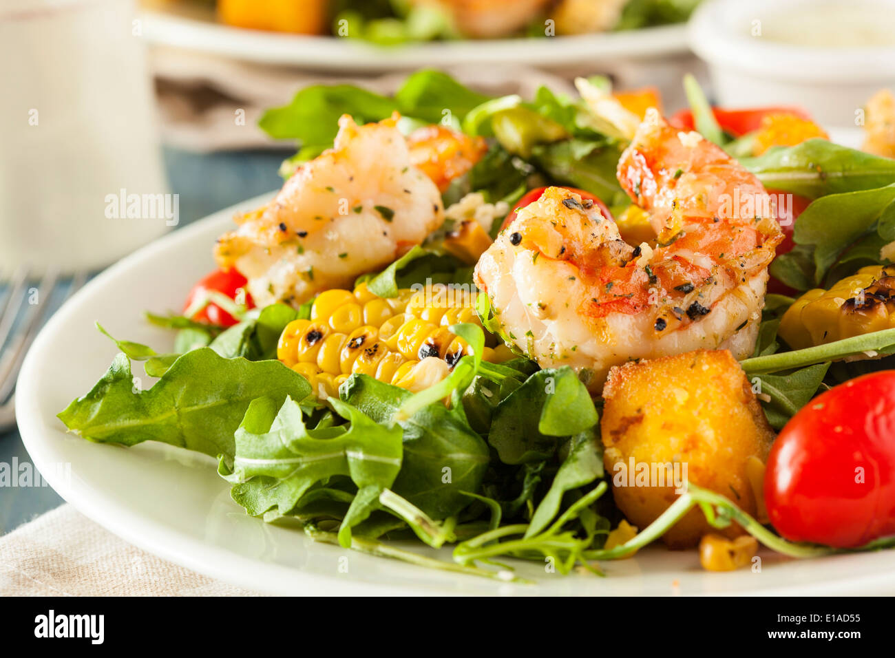 Healthy Shrimp and Arugula Salad with Corn and Tomatoes Stock Photo