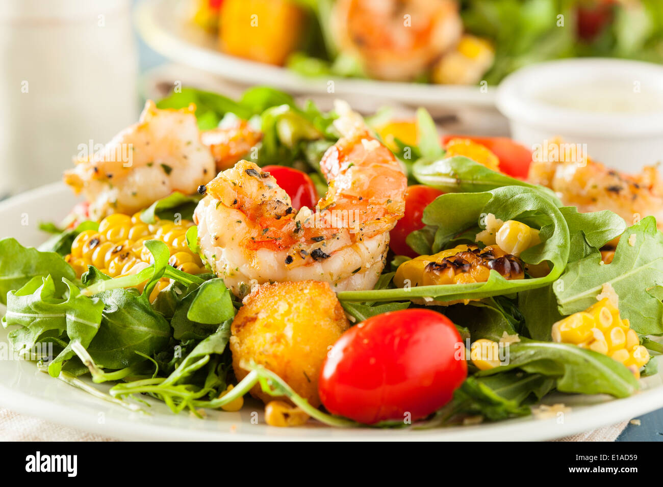 Healthy Shrimp and Arugula Salad with Corn and Tomatoes Stock Photo