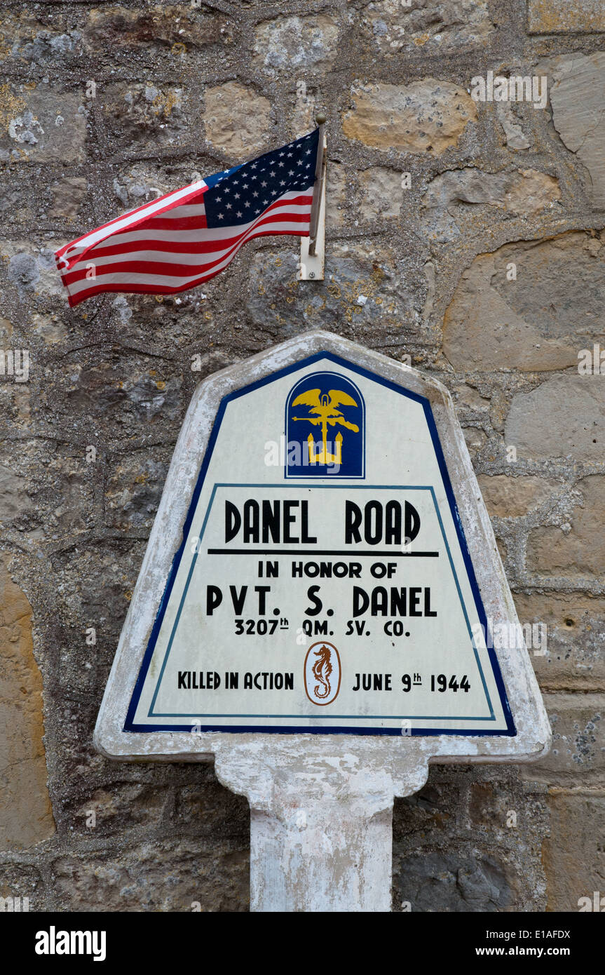 Road marker memorial in Sainte Marie du Mont honouring American soldier killed in action after D-Day landings Stock Photo