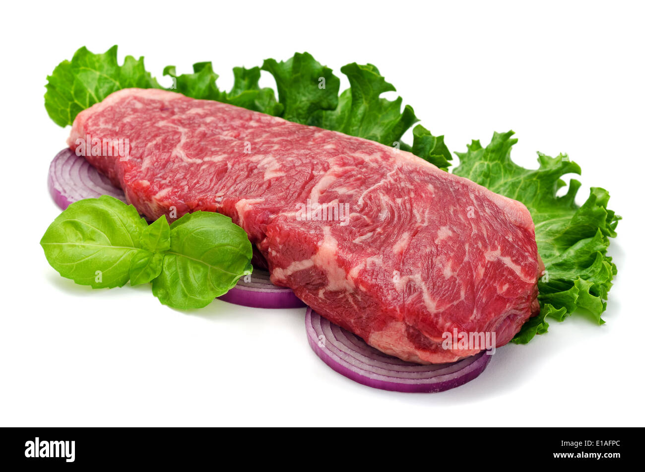 A perfectly marbled strip loin steak isolated on white. Stock Photo
