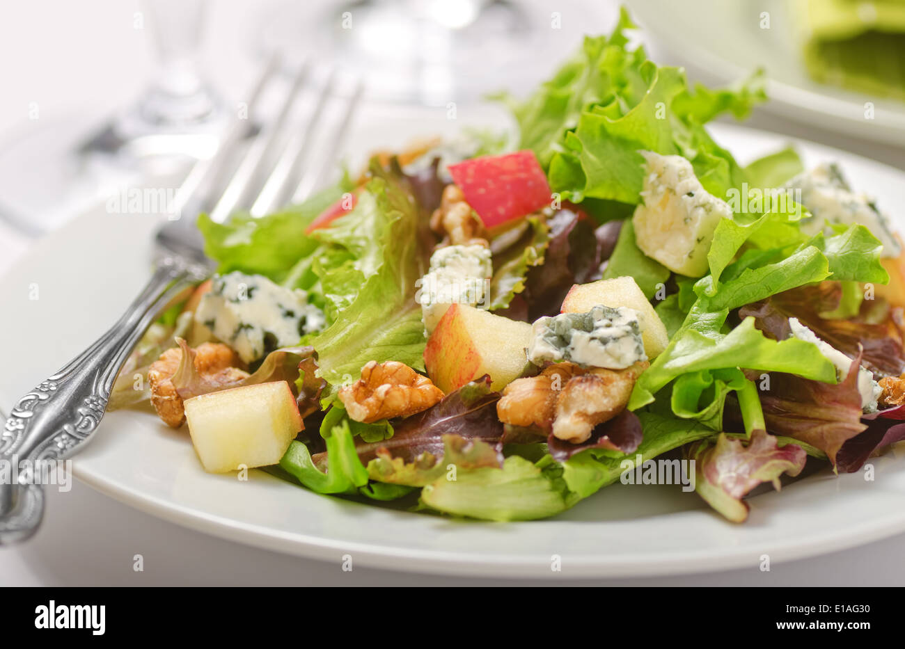 Waldorf salad with greens, apples, walnuts, and blue cheese. Stock Photo