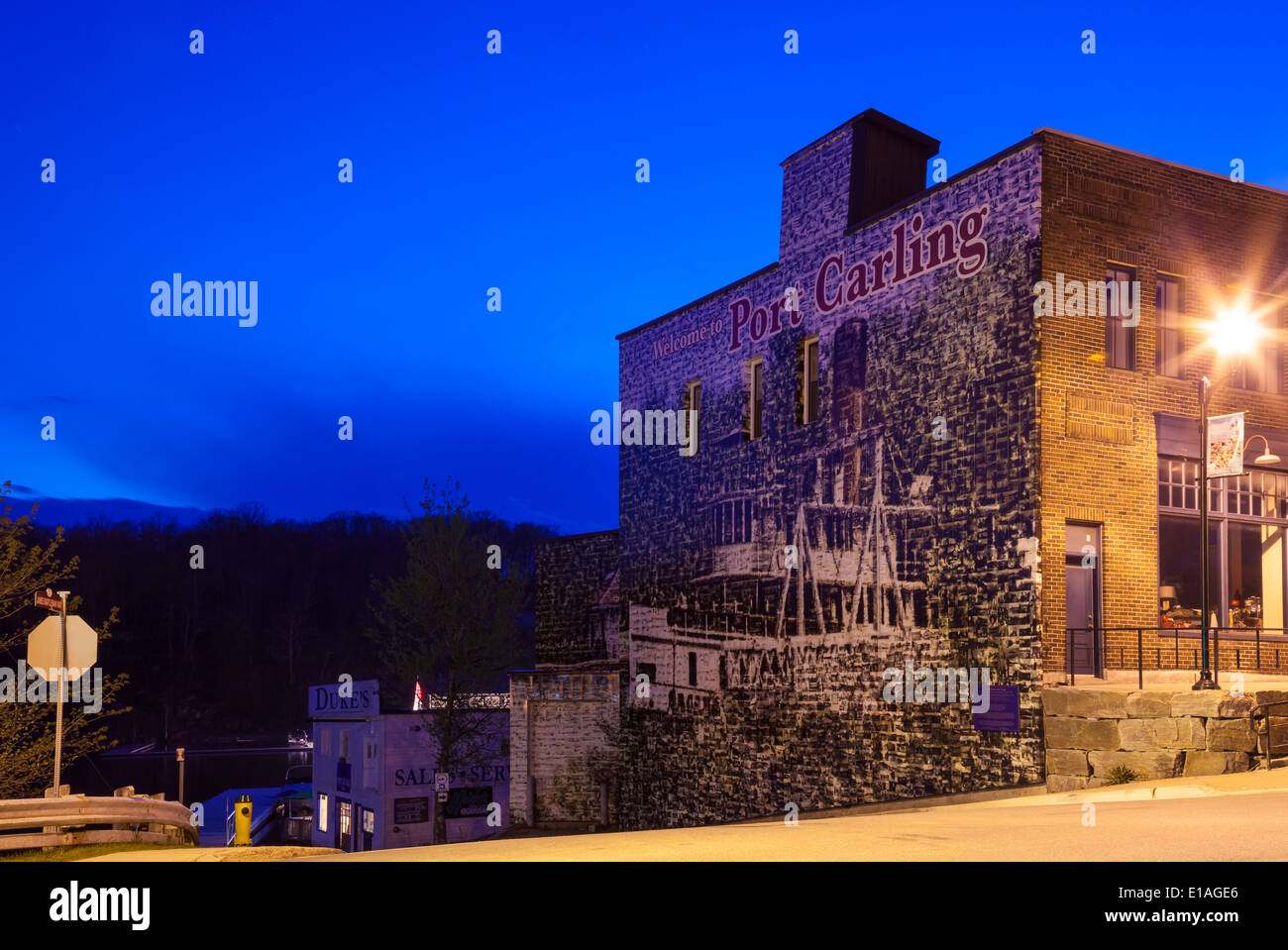 The to Port Carling' mural at dusk in downtown Port Carling