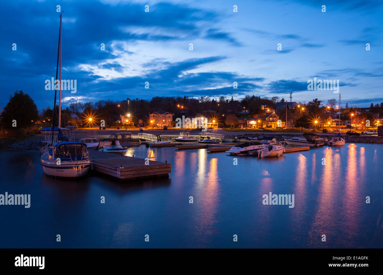 Sailboats in a small marina sitting the harbour in Parry Sound, Ontario
